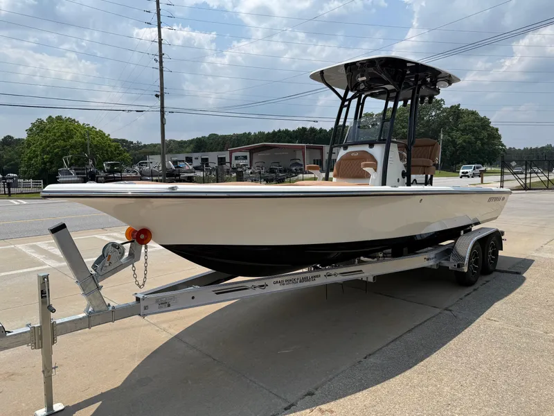 Slide: The Image of 2025 Key West 250 Bay Reef boat on trailer under sunny sky. - 3
