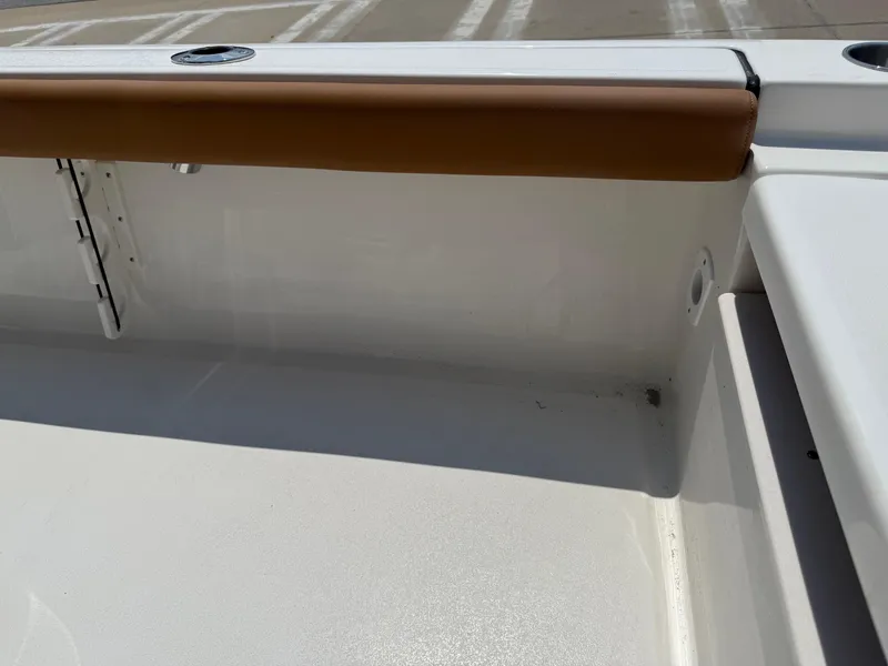 Slide: The Image of 2025 Key West 250BR boat interior with cooler and seating. - 30