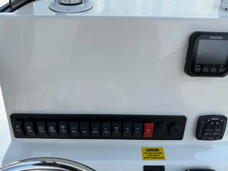 Slide: The Image of 2025 Key West 250BR boat interior with sleek design and rod holders. - 32