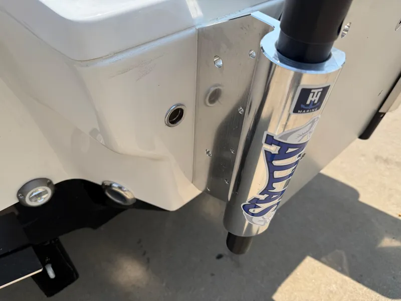 Slide: The Image of 2025 Key West 250BR boat interior with brown cushioned seating and white deck. - 34