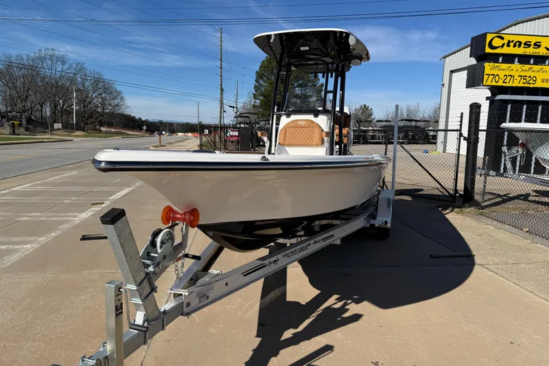 Slide: The Image of 2025 Key West 250 Bay Reef boat on trailer, parked outside dealership. - 44