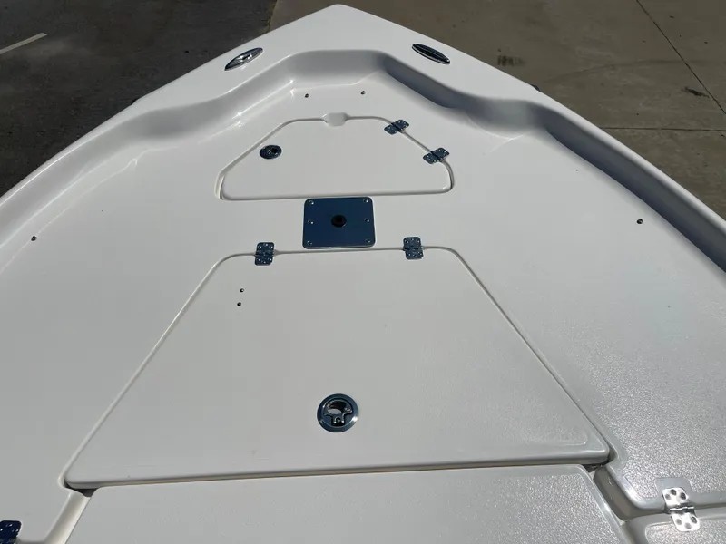 Slide: The Image of 2025 Key West 250BR boat on trailer, parked outdoors under cloudy sky. - 6