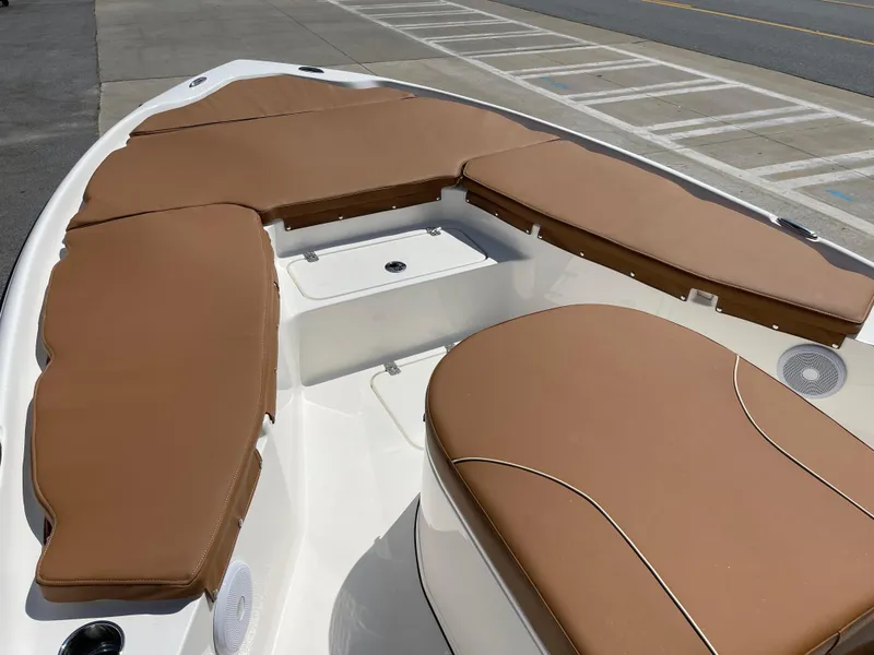 Slide: The Image of 2025 Key West 250BR boat on trailer, parked outdoors under cloudy sky. - 7