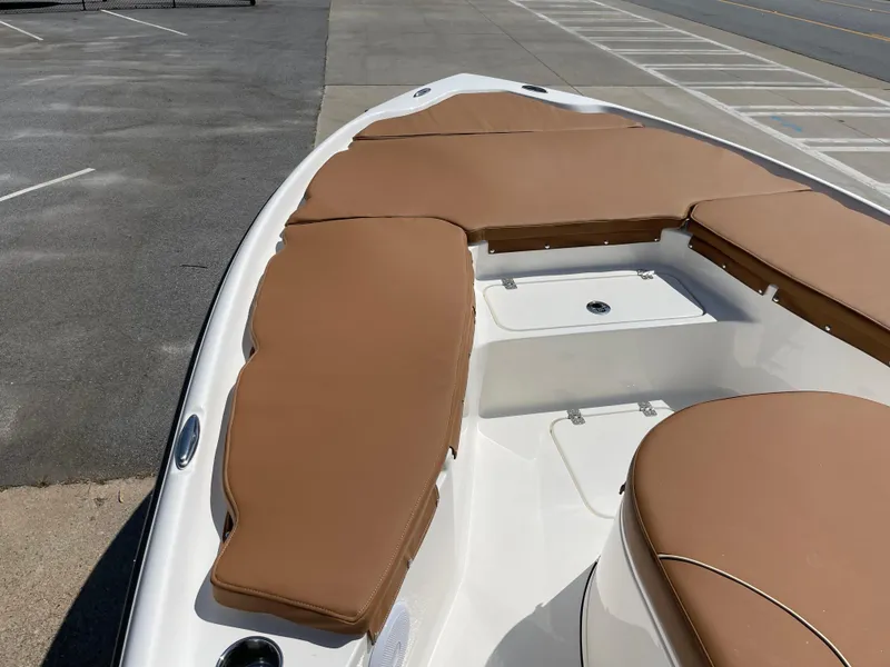 Slide: The Image of 2025 Key West 250BR boat on trailer, parked outdoors with American flag in background. - 8