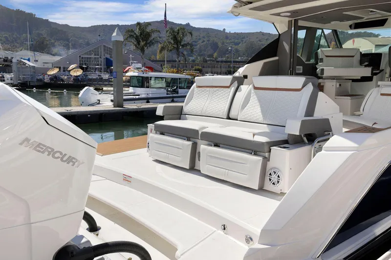 Slide: The Image of Luxury 2022 Tiara Yachts 43 LE with comfortable seating at marina. - 13