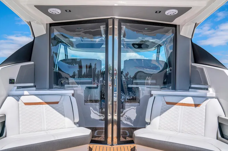 Slide: The Image of 2022 Tiara Yachts 43 LE interior with sleek seating and glass doors. - 20