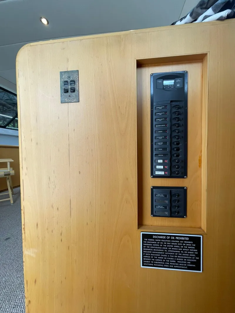 Slide: The Image of Electrical panel on 1997 Roger Hill 11.2m Powercat, featuring switches and controls. - 16