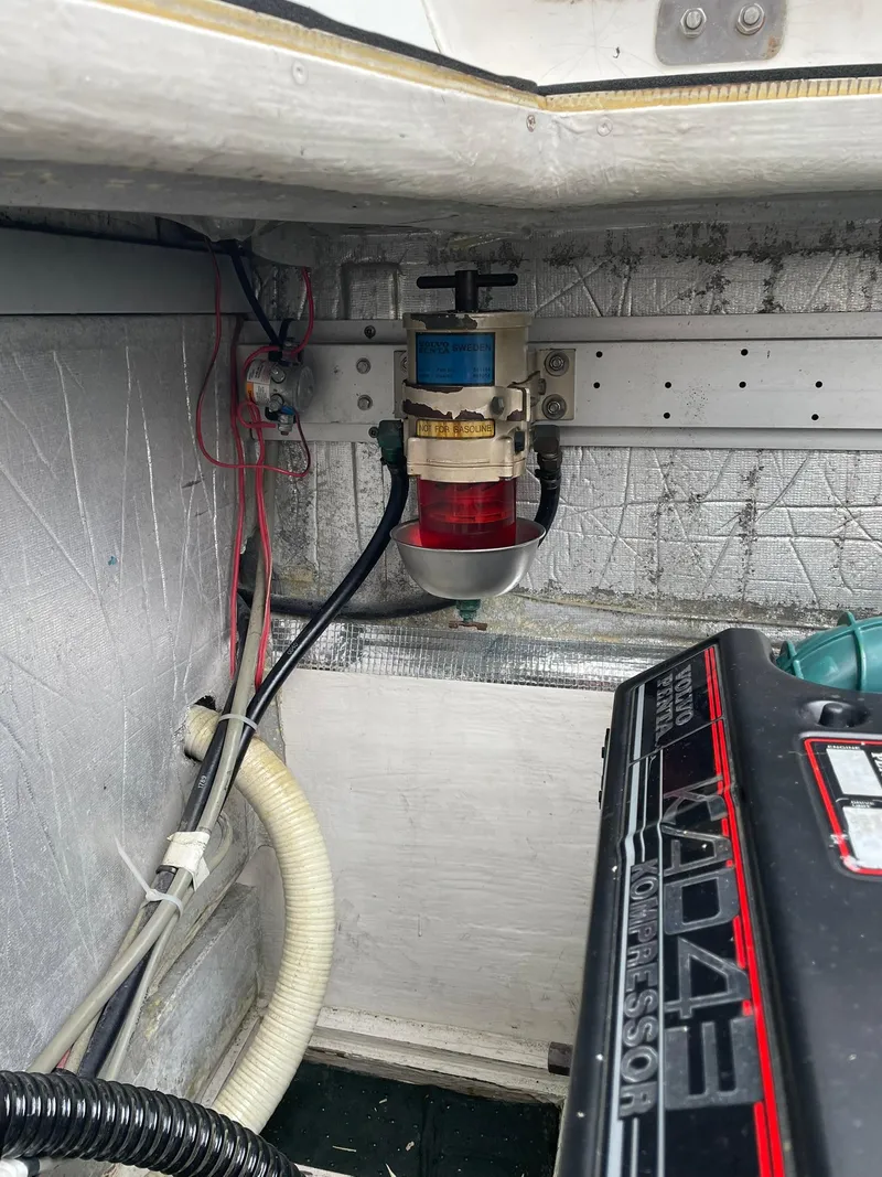 Slide: The Image of Engine compartment of 1997 Roger Hill 11.2m Powercat, featuring fuel filter and wiring. - 22