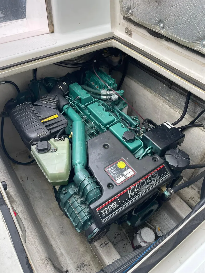 Slide: The Image of Engine compartment of a 1997 Roger Hill 11.2m Powercat, featuring a Volvo Penta engine. - 23