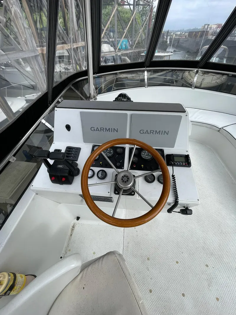 Slide: The Image of Cockpit of 1997 Roger Hill 11.2m Powercat with Garmin navigation system and wooden steering wheel. - 26