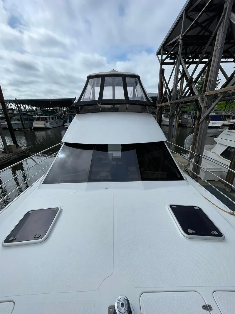 Slide: The Image of 1997 Roger Hill 11.2m Powercat docked, showcasing sleek design and spacious deck. - 31