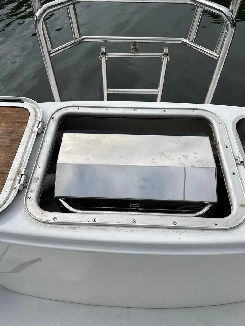 Slide: The Image of Stainless steel compartment on 1997 Roger Hill 11.2m Powercat boat, near water. - 35
