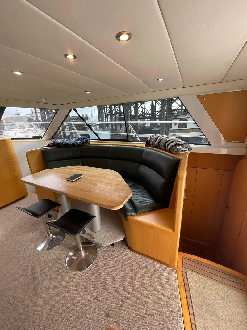 Slide: The Image of Interior of 1997 Roger Hill 11.2m Powercat with dining area and panoramic windows. - 5