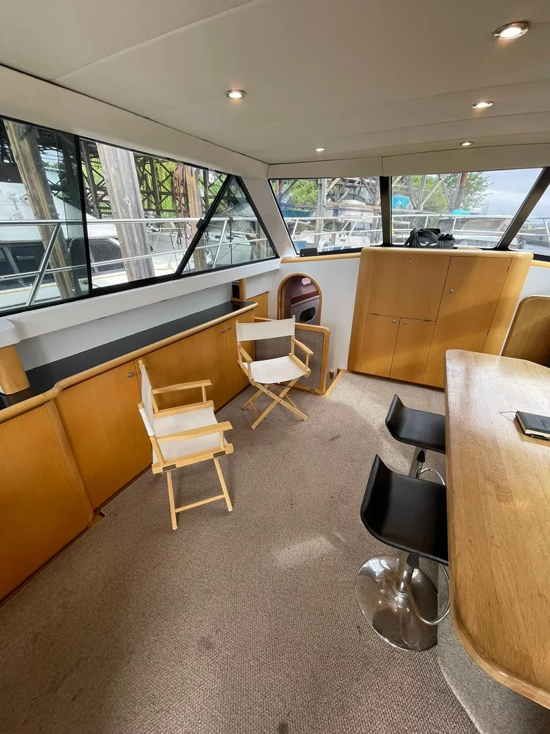 Slide: The Image of Spacious interior of 1997 Roger Hill 11.2m Powercat with modern seating and large windows. - 6