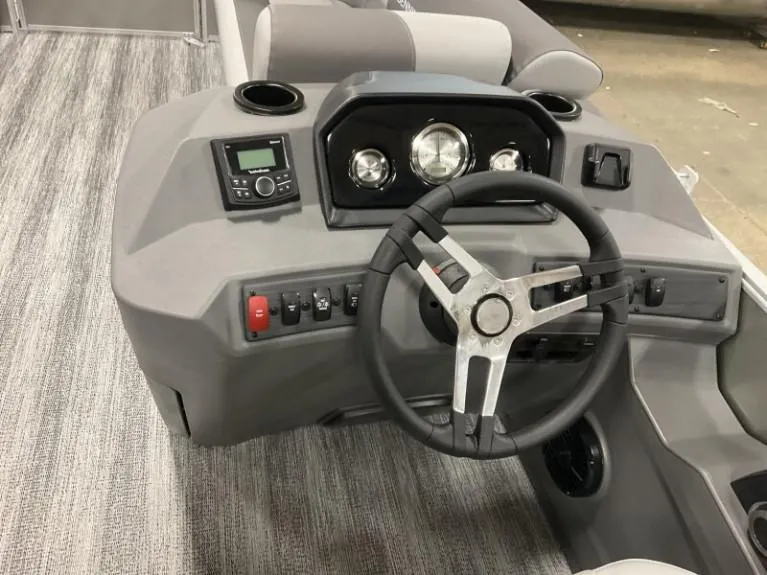 Slide: The Image of 2025 Bennington 20 SL boat dashboard with steering wheel and control panel. - 4
