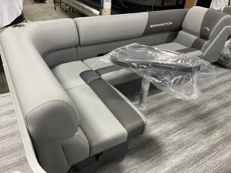 Slide: The Image of 2025 Bennington 20 SL pontoon boat interior with gray seating and table. - 5