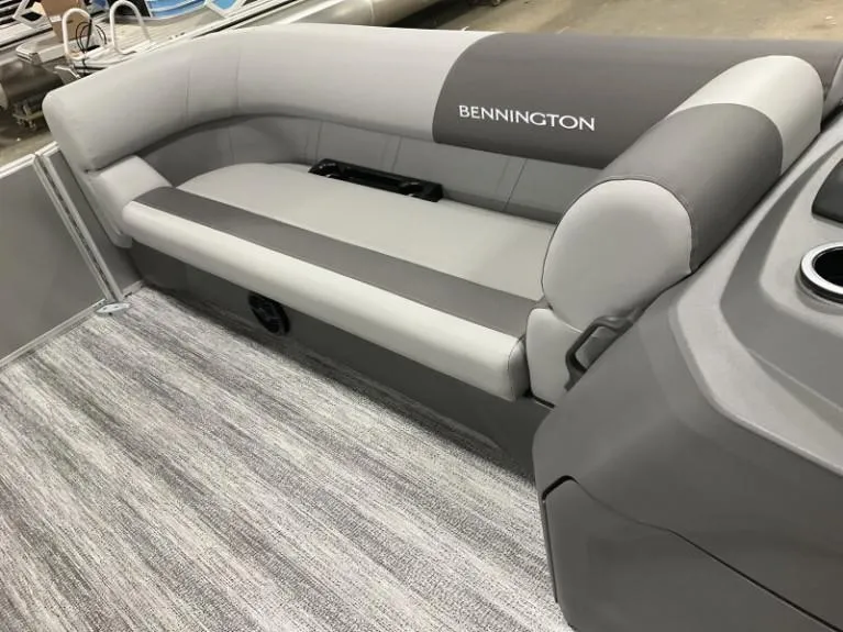 Slide: The Image of 2025 Bennington 20 SL boat interior with gray seating and modern design. - 6