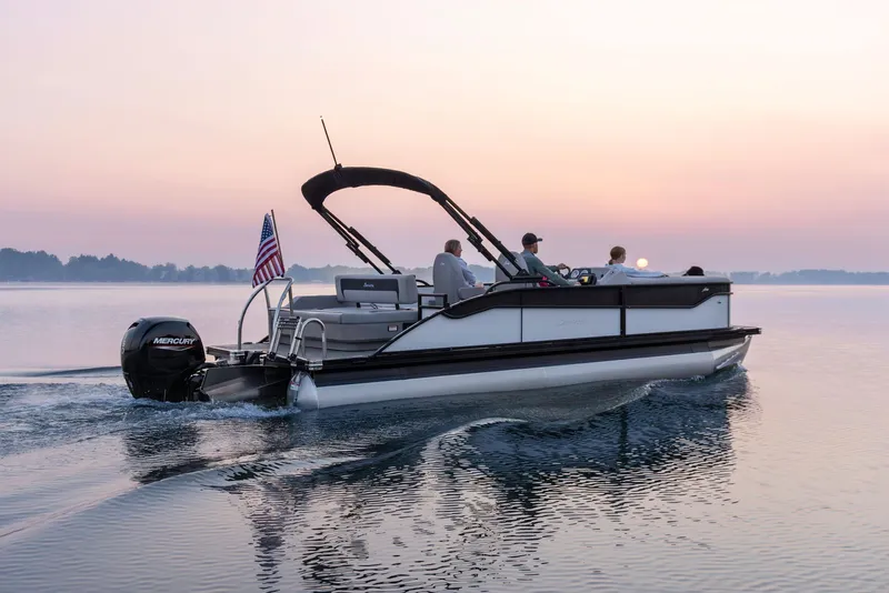 Slide: The Image of Barletta Aria 22 UC 2026 pontoon boat at sunset on calm waters. - 0