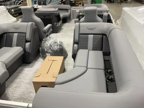 Slide: The Image of Luxurious interior of 2025 Bennington 22 MFB pontoon boat with plush gray seating. - 4