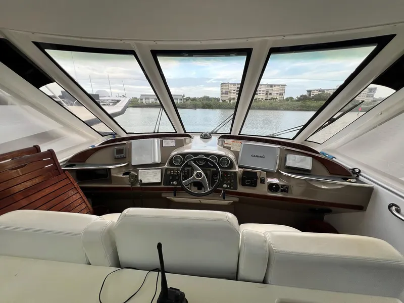 Slide: The Image of Interior view of 2000 Carver 506 Motor Yacht helm with navigation equipment and panoramic windows. - 14