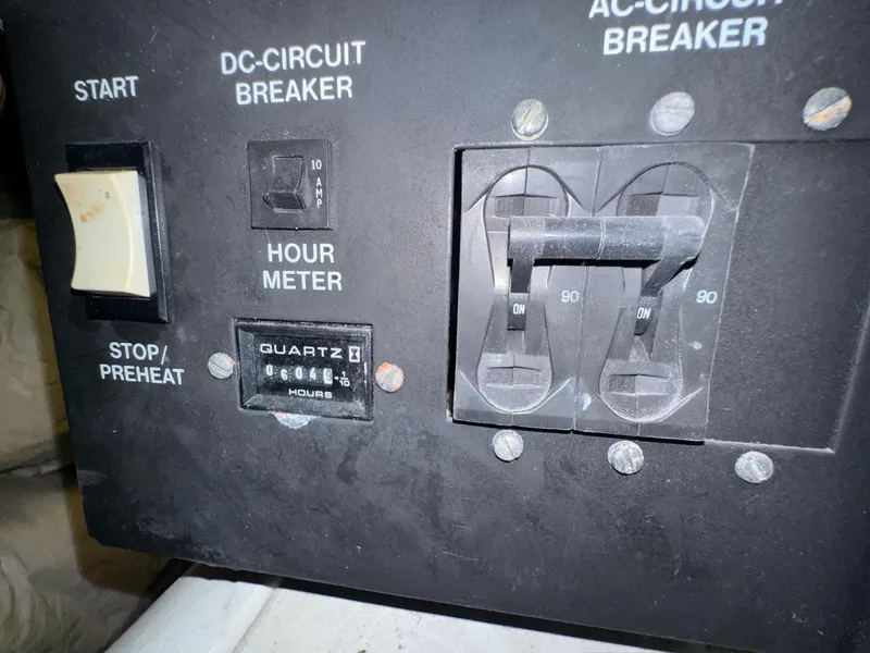 Slide: The Image of Control panel of a 2000 Carver 506 Motor Yacht with hour meter and circuit breakers. - 29