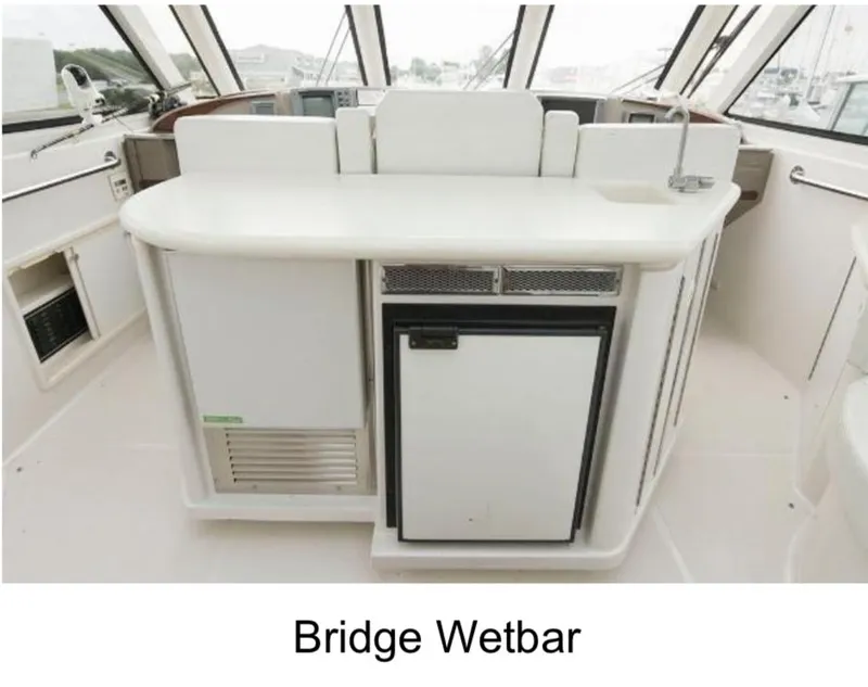 Slide: The Image of Bridge wet bar on 2000 Carver 506 Motor Yacht, featuring sleek design and modern amenities. - 4