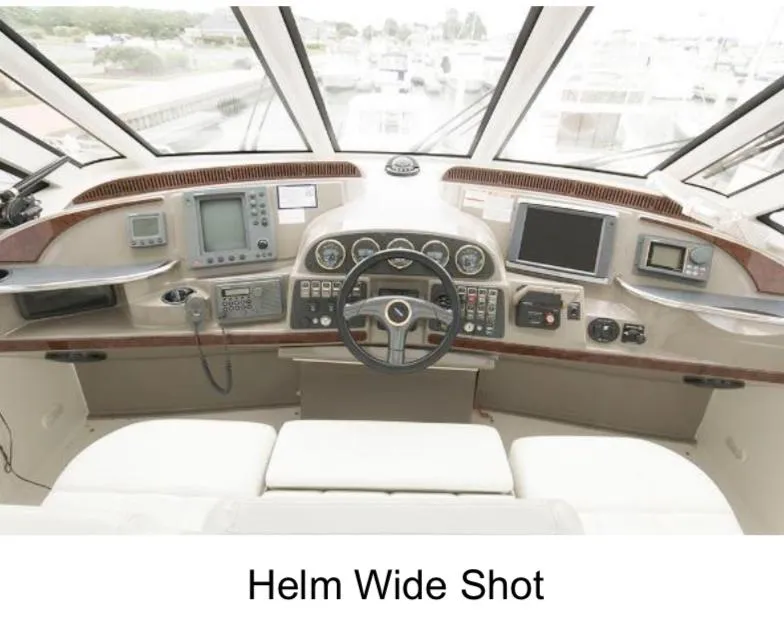 Slide: The Image of Helm of 2000 Carver 506 Motor Yacht with navigation instruments and steering wheel. - 6