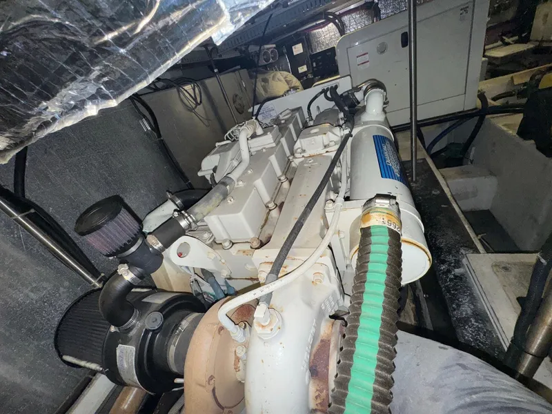 Slide: The Image of Engine room of 2000 Carver 506 Motor Yacht, showcasing mechanical components and systems. - 25