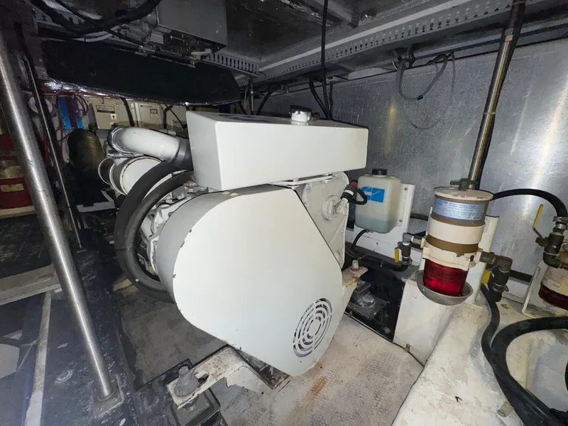 Slide: The Image of Engine room of 2000 Carver 506 Motor Yacht, showcasing machinery and components. - 27