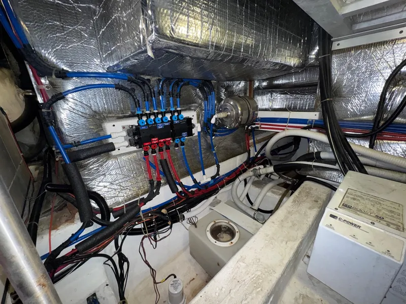Slide: The Image of Engine room of a 2000 Carver 506 Motor Yacht with wiring and insulation. - 30