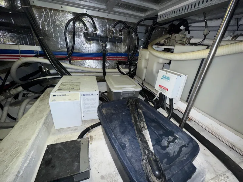 Slide: The Image of Engine room of 2000 Carver 506 Motor Yacht with various equipment and wiring. - 31