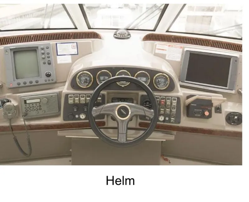 Slide: The Image of Helm of 2000 Carver 506 Motor Yacht with navigation instruments and steering wheel. - 7
