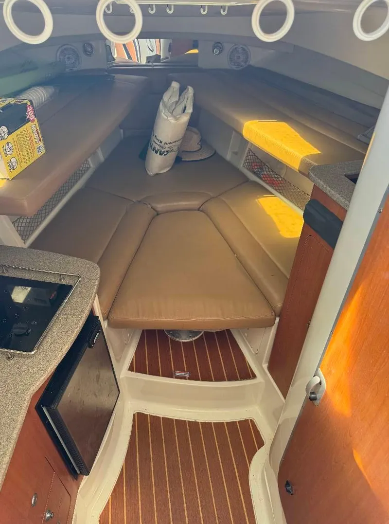 Slide: The Image of 2008 Sailfish 30-06 Express cabin interior with seating and kitchenette. - 8