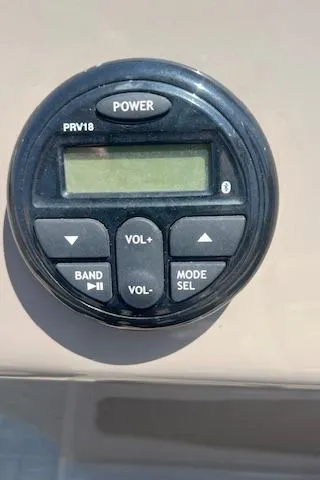 Slide: The Image of Control panel on 2021 Sun Tracker Party Barge 20 DLX with power and volume buttons. - 19