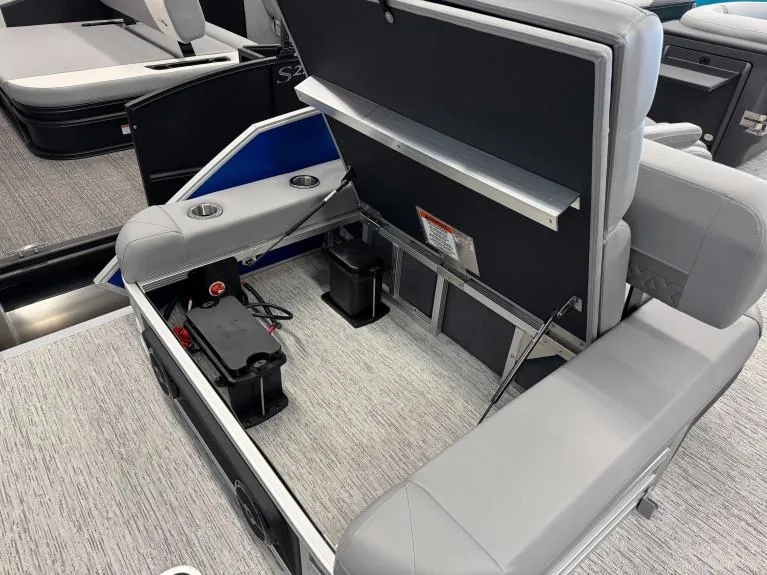 Slide: The Image of 2025 Bennington 22 MSB boat interior with open storage compartment and seating. - 5