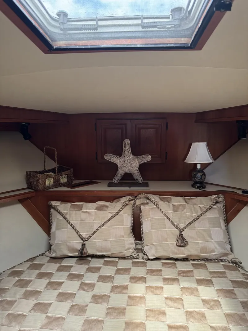 Slide: The Image of Cozy cabin interior of 1989 Viking 45 Convertible yacht with skylight and decorative pillows. - 15
