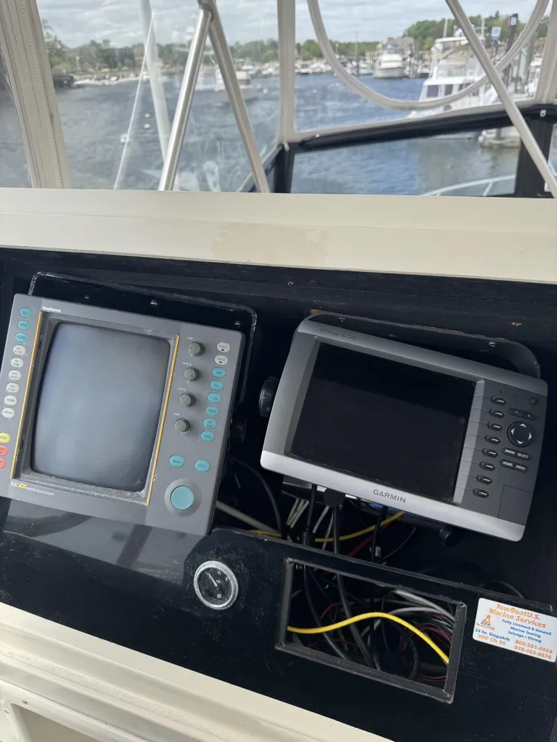 Slide: The Image of 1989 Viking 45 Convertible boat dashboard with navigation equipment. - 19