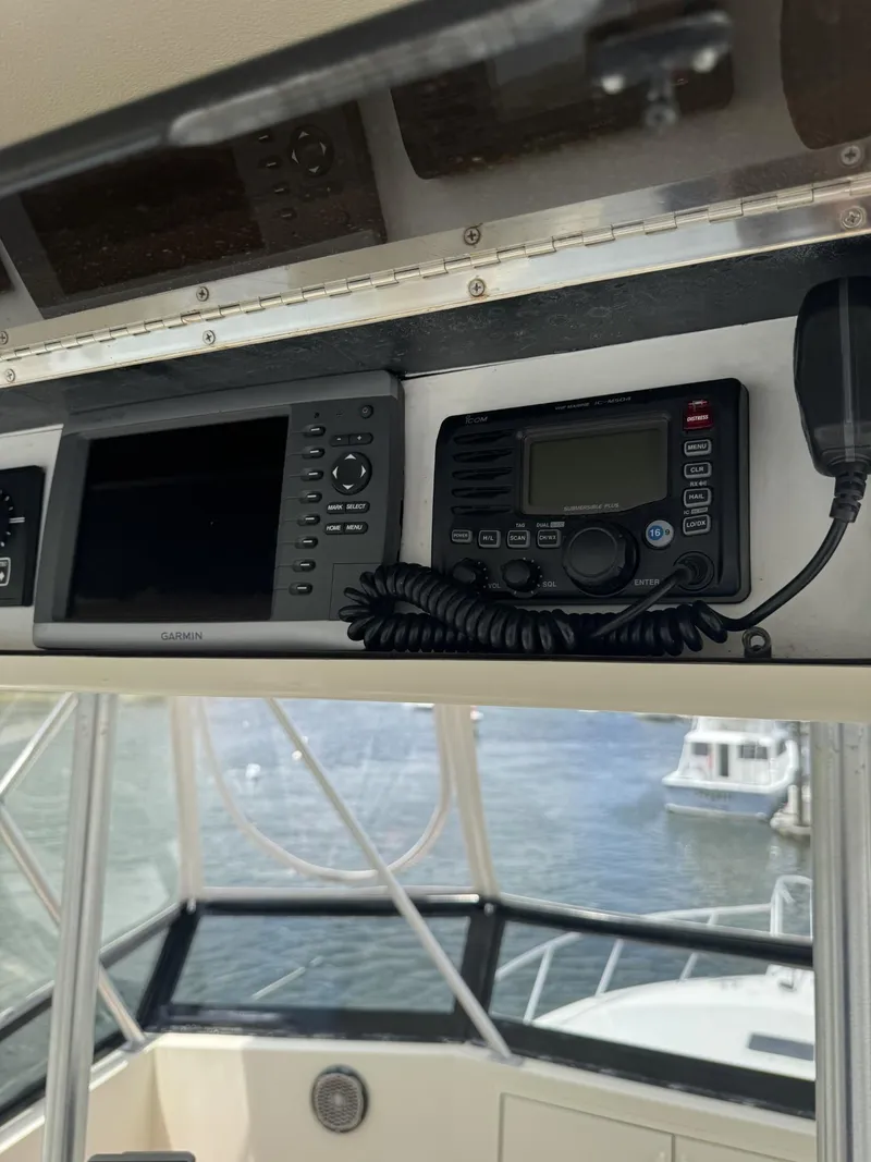 Slide: The Image of 1989 Viking 45 Convertible boat dashboard with navigation and communication equipment. - 20
