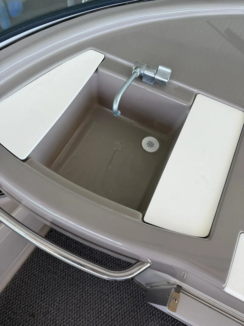 Slide: The Image of 2000 Carver 350 Mariner boat sink with faucet and drain. - 10