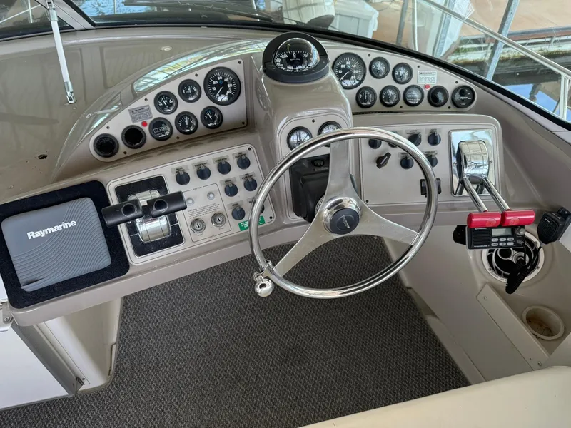 Slide: The Image of Helm of 2000 Carver 350 Mariner with Raymarine navigation system and control panel. - 13
