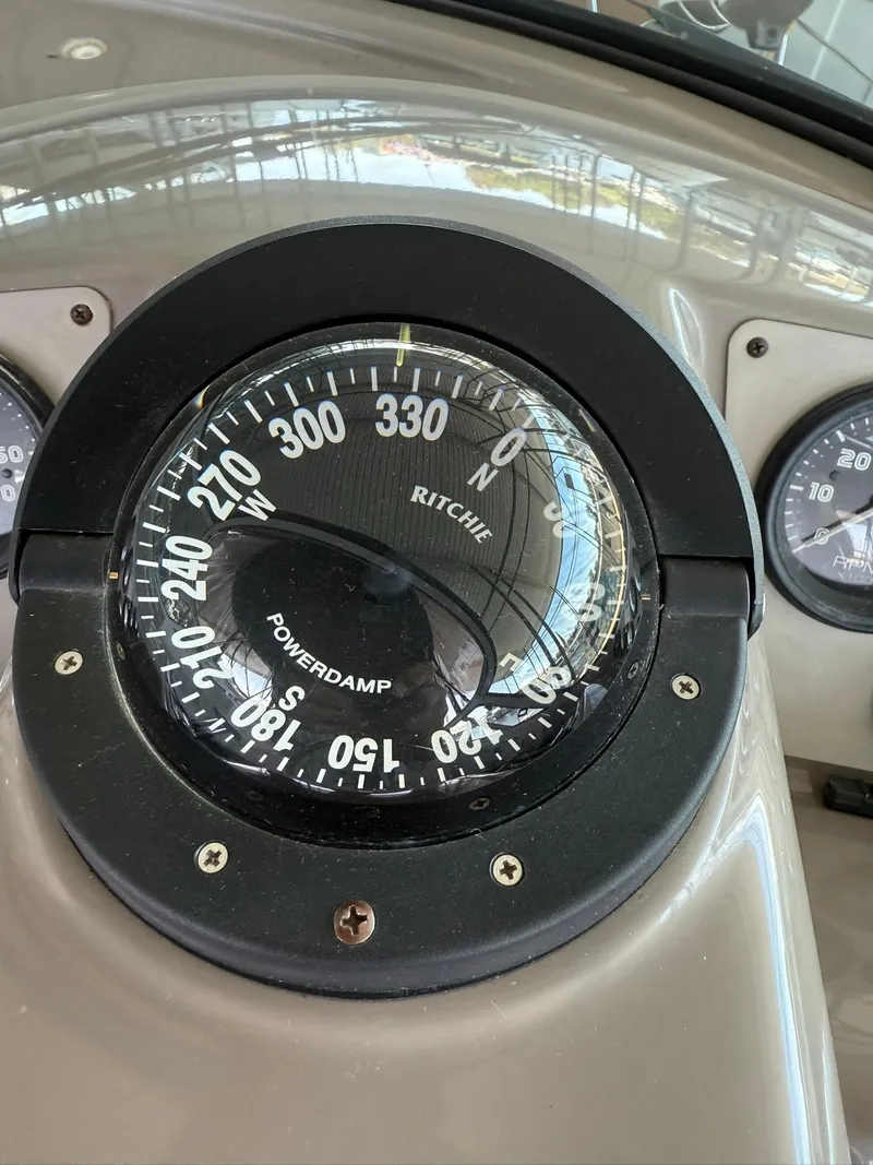 Slide: The Image of Compass on 2000 Carver 350 Mariner boat dashboard, showing navigation details. - 18