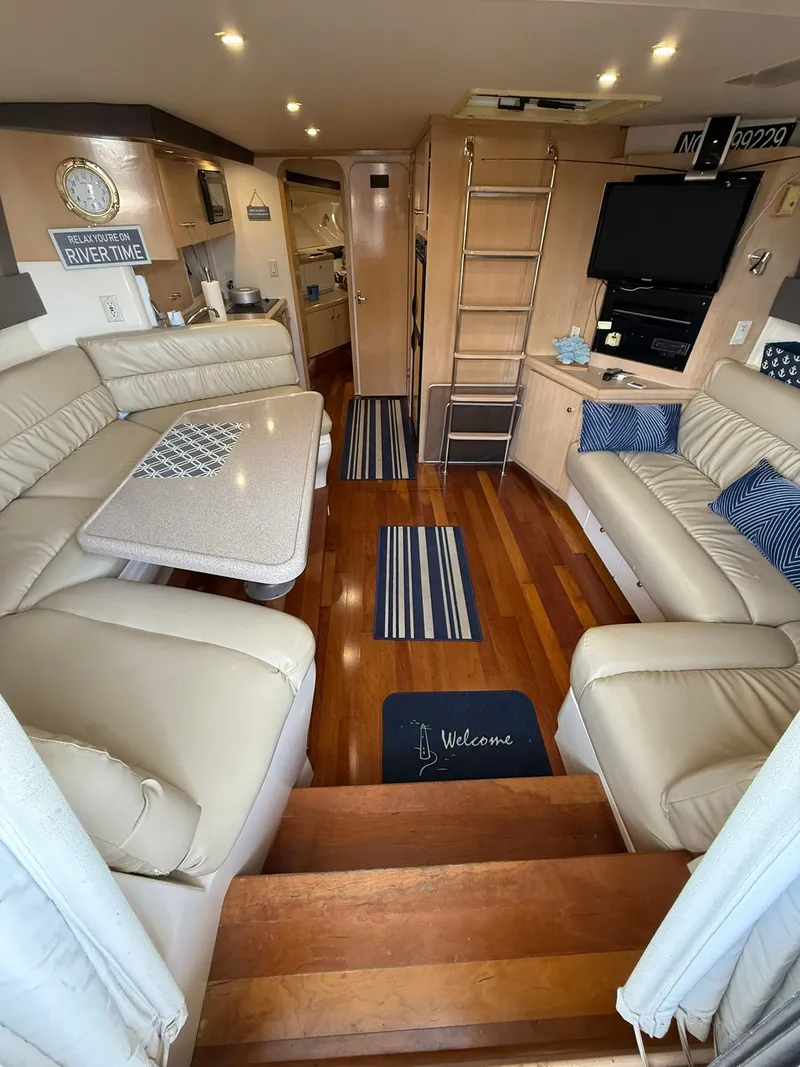 Slide: The Image of Interior of 2000 Carver 350 Mariner yacht with luxurious seating and modern amenities. - 21