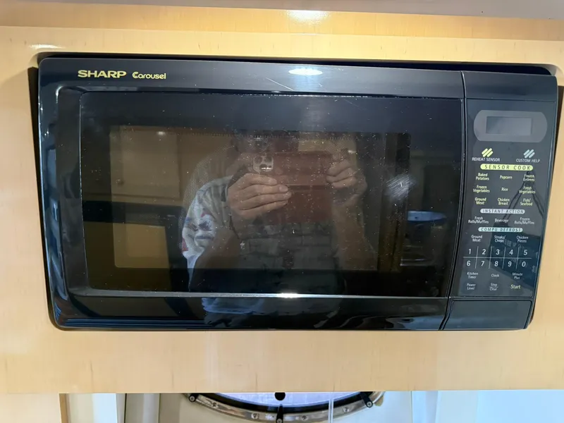 Slide: The Image of Sharp Carousel microwave in a 2000 Carver 350 Mariner yacht kitchen. - 29