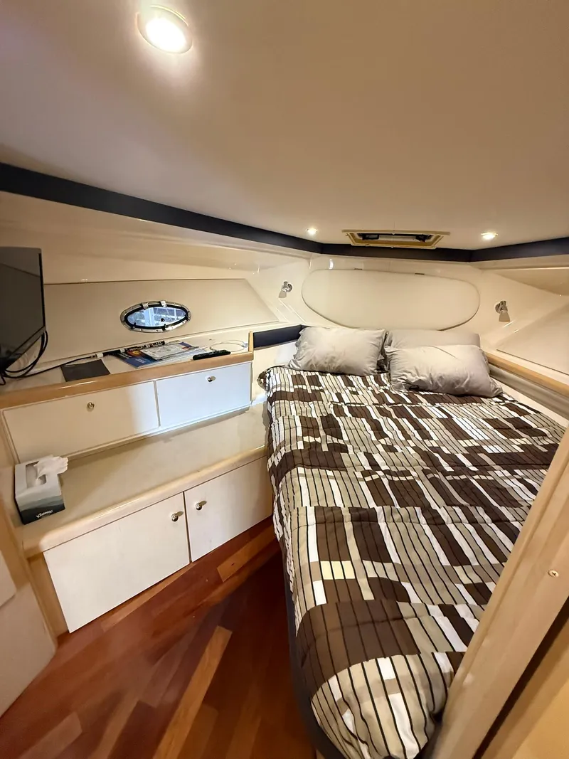Slide: The Image of Interior of 2000 Carver 350 Mariner yacht with cozy bed and modern amenities. - 31