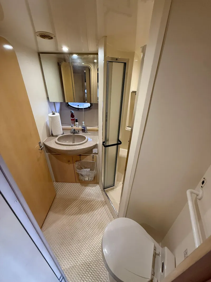 Slide: The Image of 2000 Carver 350 Mariner bathroom with sink, toilet, and shower. - 33