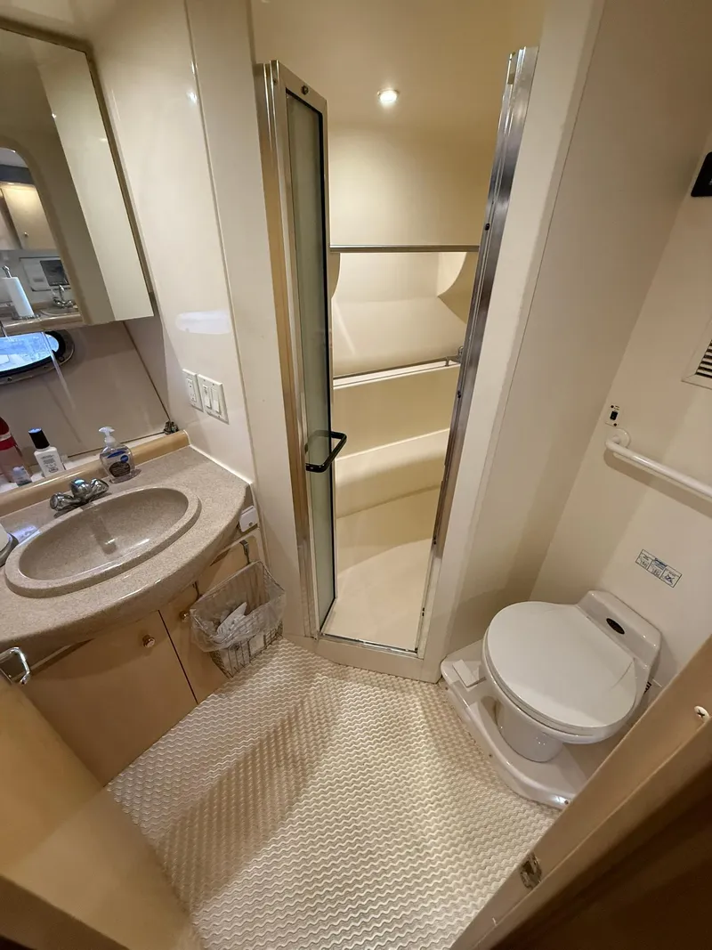 Slide: The Image of 2000 Carver 350 Mariner bathroom with sink, toilet, and shower. - 34