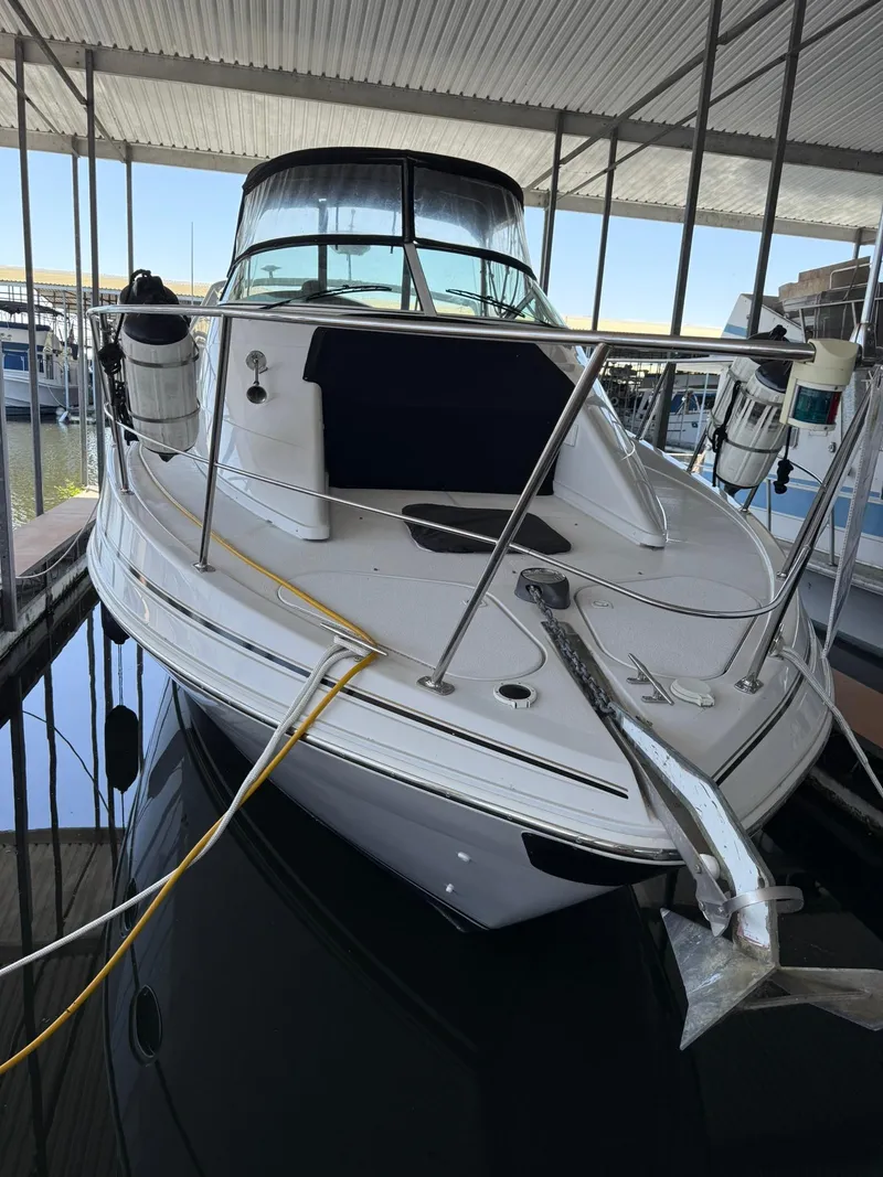 Slide: The Image of 2000 Carver 350 Mariner docked in a covered marina. - 1