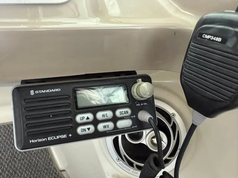 Slide: The Image of Standard Horizon Eclipse marine radio on 2000 Carver 350 Mariner boat dashboard. - 14