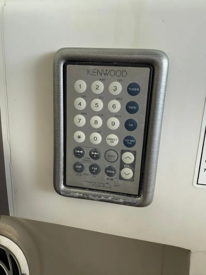 Slide: The Image of Kenwood control panel on 2000 Carver 350 Mariner boat. - 15