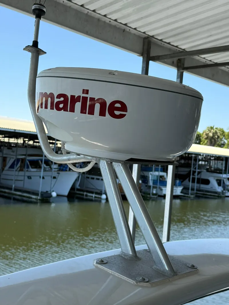 Slide: The Image of Radar dome on 2000 Carver 350 Mariner boat, docked in a marina. - 16